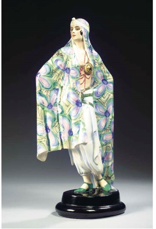 A POLYCHROME PORCELAIN FIGURE