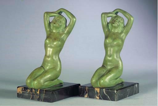 (2)A PAIR OF SPELTER BOOKRESTS