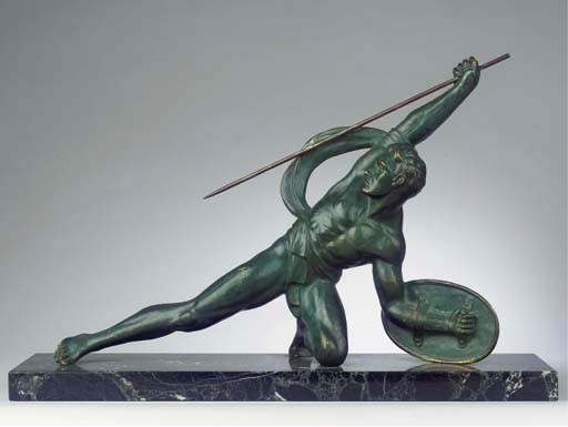 A GREEN PATINATED BRONZE FIGURE OF AN ARCHER