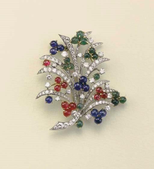 Spilla in oro con brillanti, rubini, zaffiri e smeraldi cabochon, firmata Bulgari