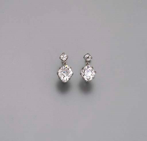 A PAIR OF DIAMOND TWO-STONE EARRINGS