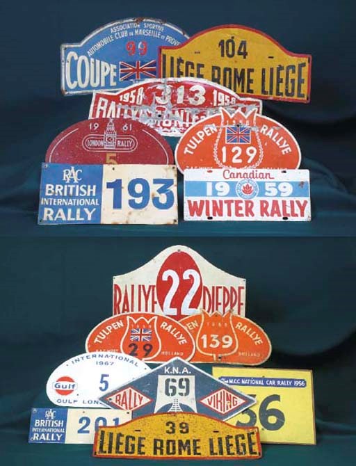 Monte Carlo Rally & Others  - A group of car race-number plates including Rallye Monte Carlo 1958 (no. 313), Liege-Rome-Liege undated (nos 39 & 104 respectively), Coupe des Alpes undated (no. 99), London Rally 1961, RAC Rally undated  (nos 121, 193 & 201 respectively), MCC Rally 1956, Dieppe undated (nos 22 & 137 respectively), London Motor Club International 1967 (no.5), KNA Viking Rally 1958, Canadian Winter Rally 1959 & Lyon-Charbonnieres Solitude Rallye undated. (15) 	 (15)