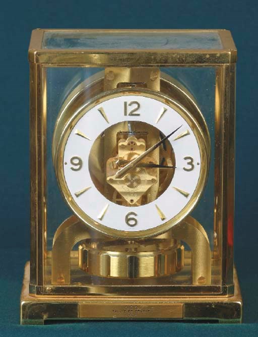 Automobile Club de Suisse - Rallye Internationale de Geneve; A fine rally award in the form of an Atmospheric Regulator clock by Jaeger le Coultre; having applied plaque to base inscribed 'ACS Rallye de Geneve - 1962'; contained in gilded brass glazed case.