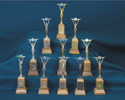 RAC International Rally 1960, 1962 & 1963 - A group of gold, Silver & bronze statueete award trophies including 'Ladies Award - 2nd':'Class 6 - 2nd':'Brands Hatch - 2nd':'RAC Rally Championship 2nd - Miss P. Moss':'1st Class 6' & '3rd General Classification'.       (5)