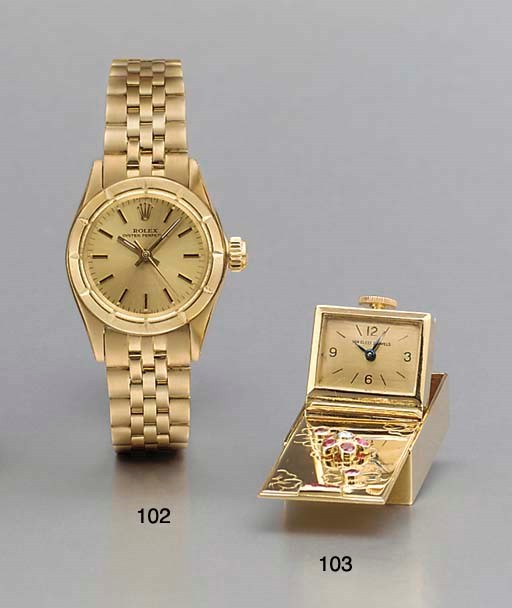 Rolex. A lady's 18K gold self-winding water-resistant wristwatch with bracelet