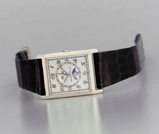 Audemars Piguet. A fine and rare 18K white gold rectangular-shaped full calendar hinged wristwatch with phases of the moon