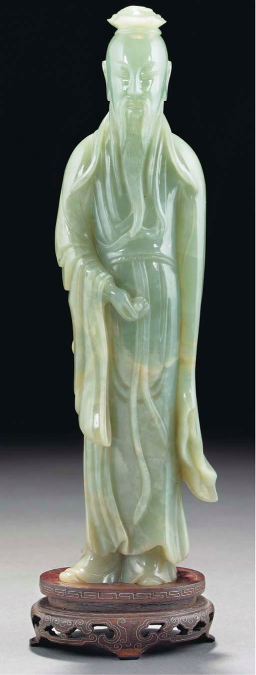 A large celadon jade figure of an immortal, 19th Century