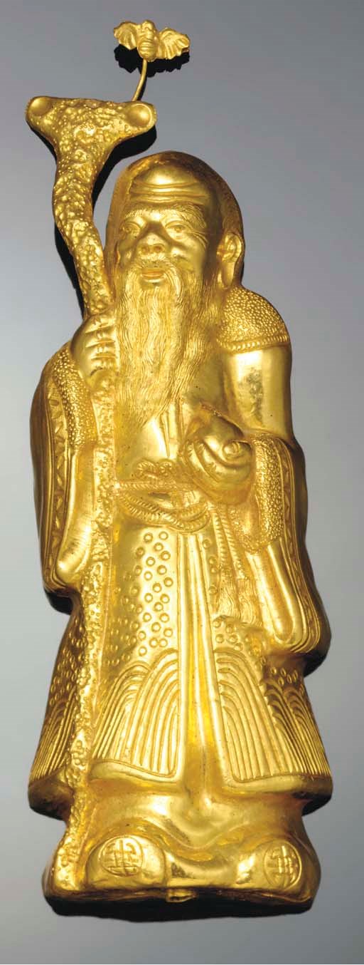 A twenty-four carat gold repousse model of Shoulao, 19th century