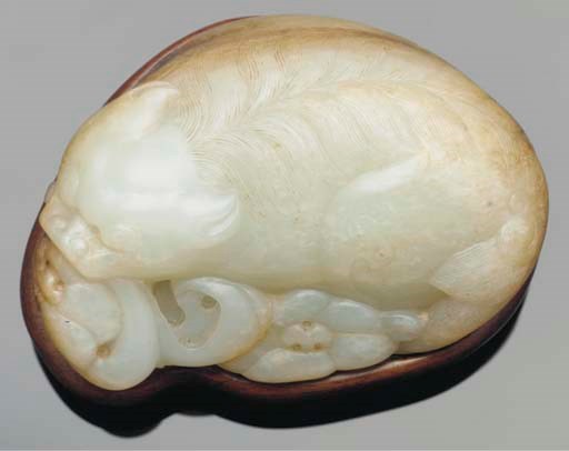 A mottled celadon jade model of a lion, 18th Century