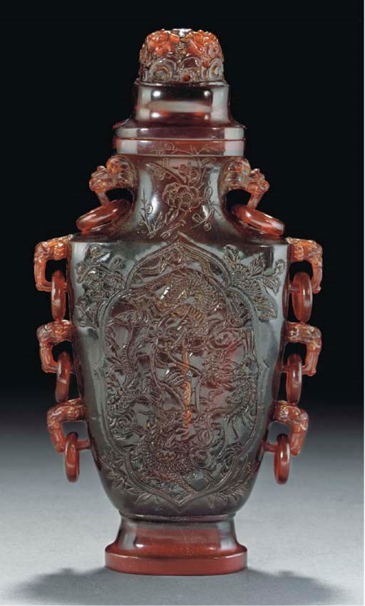 A carved amber vase and cover, 19th Century