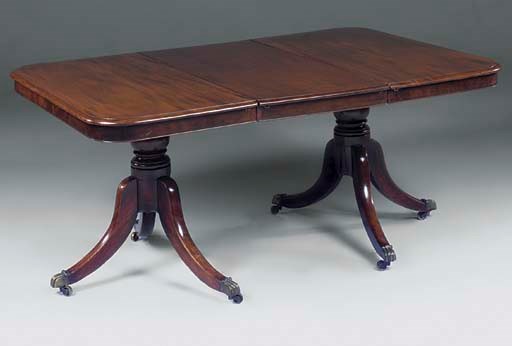 A MAHOGANY TWIN PEDESTAL DINING TABLE