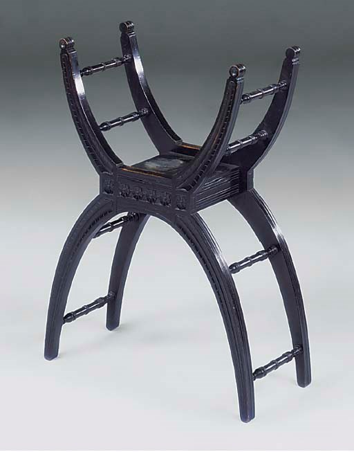 AN EBONISED FOLIO STAND