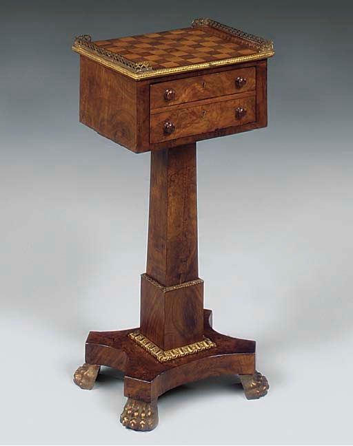 A WALNUT AND GILT METAL MOUNTED GAMES TABLE