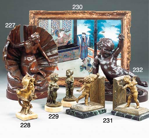 A pair of French bronze figures of infant boys