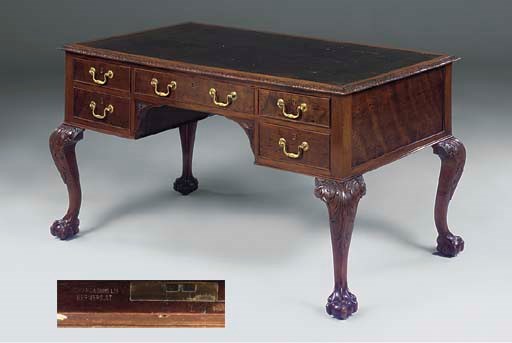 A PLUM PUDDING MAHOGANY DESK