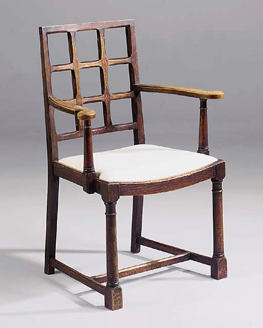 A SET OF FOUR STAINED OAK DINING CHAIRS