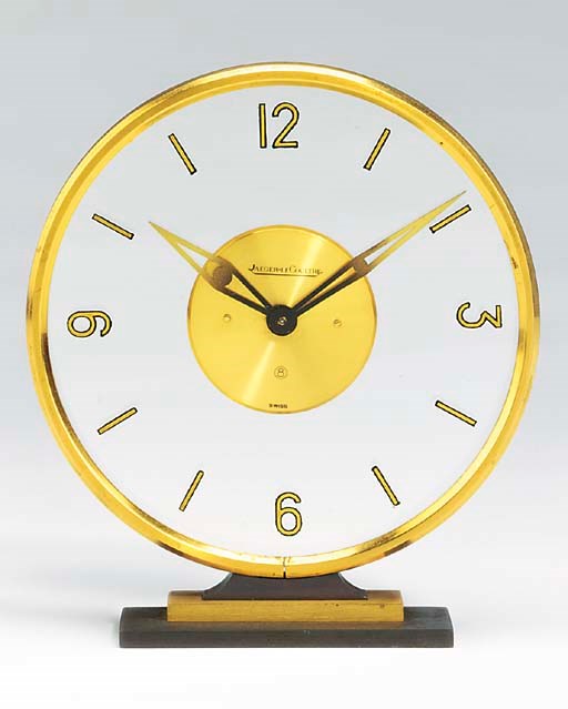 A Swiss gilt and patinated brass desk timepiece, 1970s