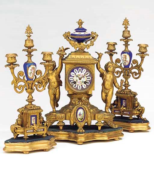 A French gilt-spelter and porcelain-mounted striking mantel clock and garniture, circa 1880