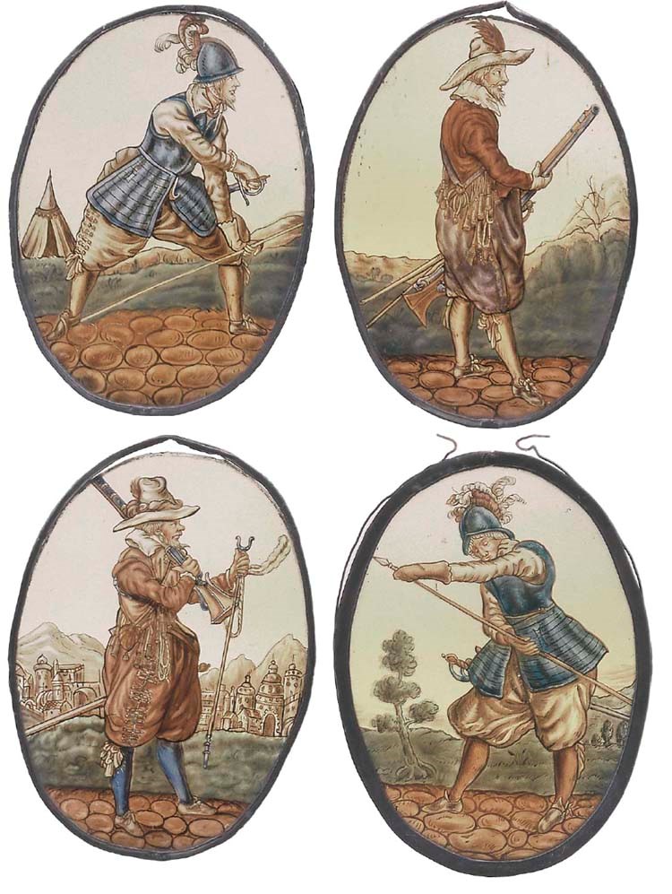 A SET OF FOUR OVAL STAINED GLASS PANELS