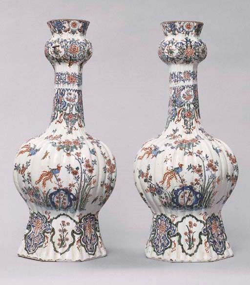 A PAIR OF DUTCH DELFT POLYCHROME RIBBED INVERTED BALUSTER VASES