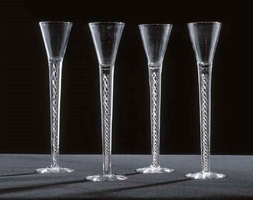 FOUR DRAWN-TRMPET WINE GLASSES