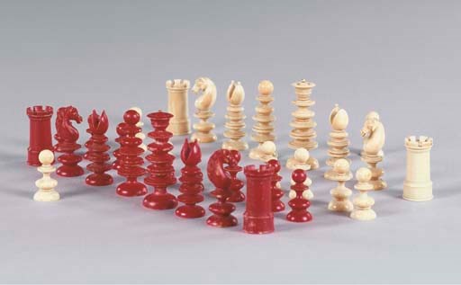 AN ENGLISH IVORY AND RED STAINED CHESS SET