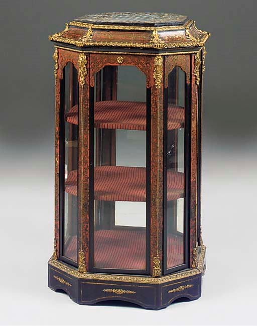 A FRENCH GILT METAL MOUNTED EBONISED AND INLAID DISPLAY CABINET