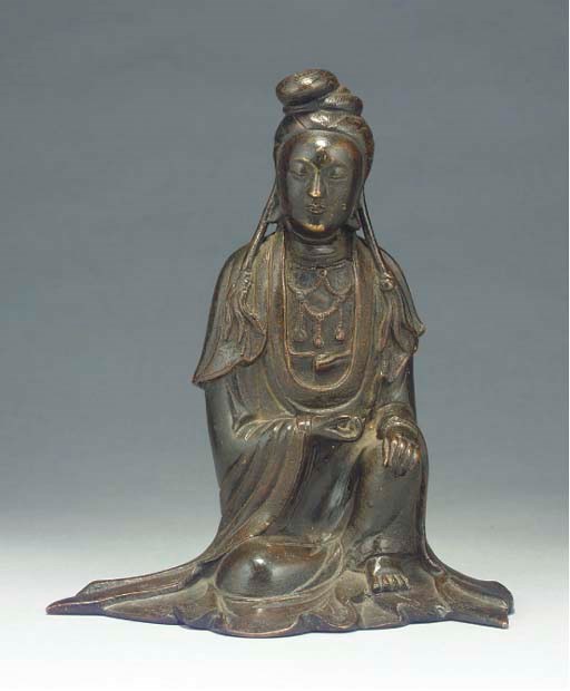 A Chinese bronze model of Guanyin, 17th Century