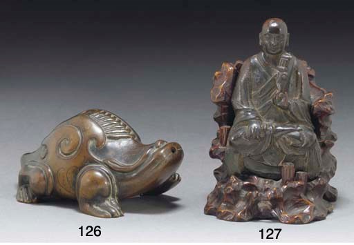 A Chinese bronze model of a lohan, 17th century