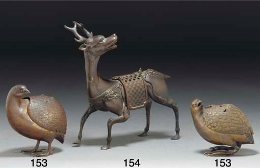 A Japanese bronze koro and cover modelled as a stag, 19th century