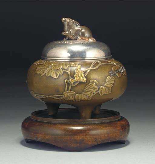 A Japanese bronze and inlaid tripod koro, silver cover and linner, 19th century