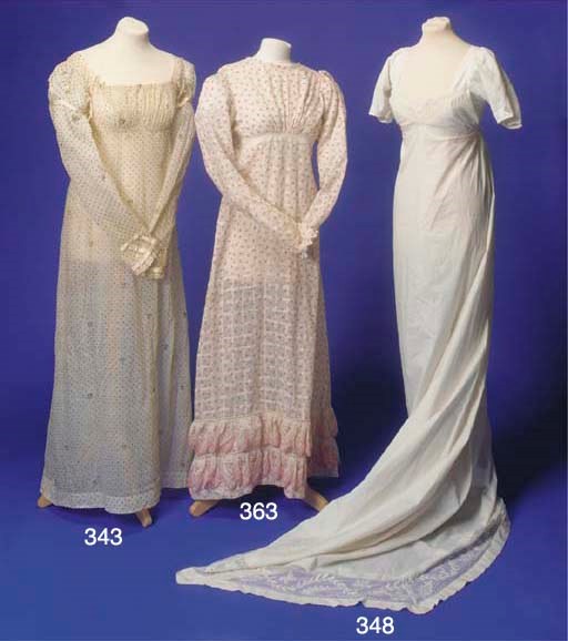 A lady's day dress of white muslin, woven with large checks and printed all over in madder with sprig motifs, the high-waisted bodice with high neck-line, rouching to waist-line and button detailing to the reverse, having full-length sleeves with Vandyke edging to cuffs, the skirt with two Vandyke flounces to hemline, some darning to bodice and some damages, circa 1820