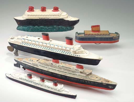 A miniature scale model and a ceramic piggy bank of the S.S. Normandie, a wind-up toy of the S.S. Liberte, a wind-up toy of the S.S. Bremen, a push toy of the R.M.S. Queen Mary