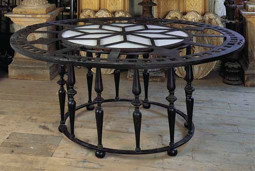A LARGE CAST IRON 'CLOCK-FACE' TABLE