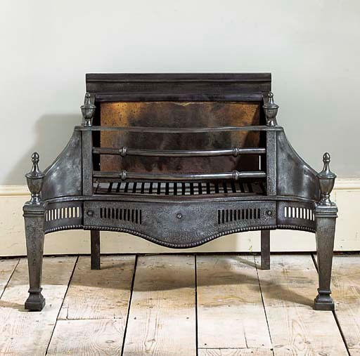An English polished iron fire grate
