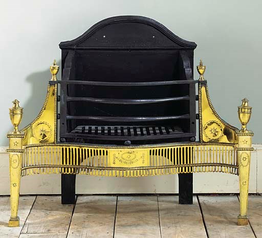 AN ENGLISH CAST IRON AND BRASS FIREGRATE