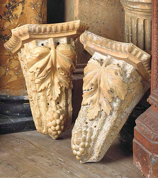 A PAIR OF ENGLISH TERRACOTTA BRACKETS