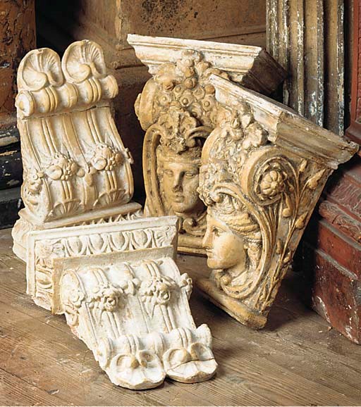 A PAIR OF ENGLISH PLASTER CORBELS