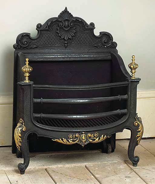 AN ENGLISH CAST IRON BRASS MOUNTED FIREGRATE