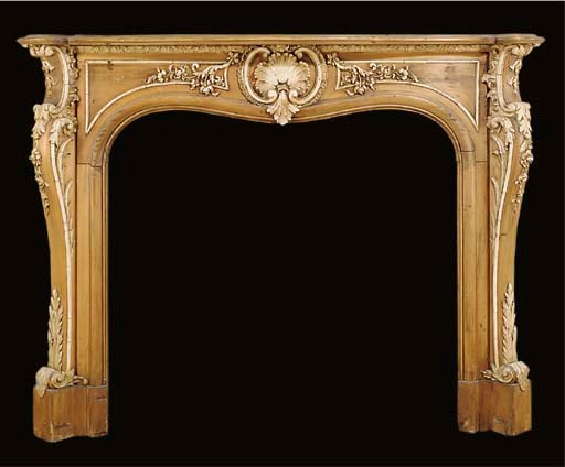 A PINE AND GESSO CHIMNEYPIECE