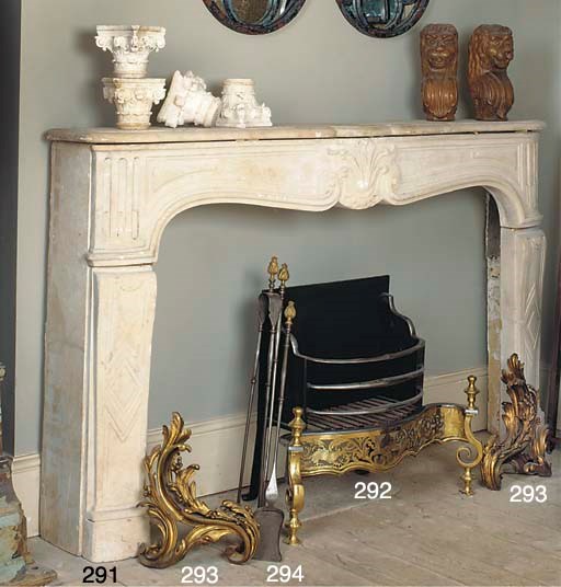 A LOUIS XV LIMESTONE CHIMNEYPIECE