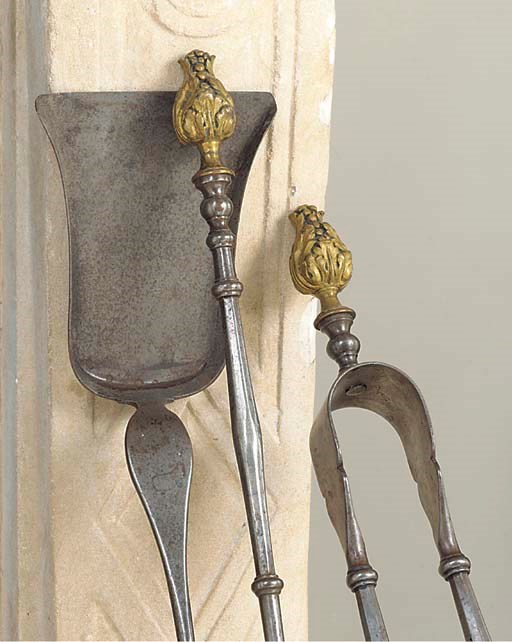 A SET OF THREE CONTINENTAL STEEL AND ORMOLU FIRE IRONS