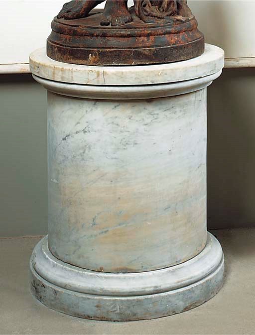 A large Carrara marble pedestal