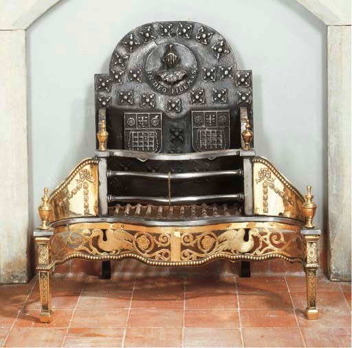 AN ENGLISH CAST IRON AND BRASS FIREGRATE