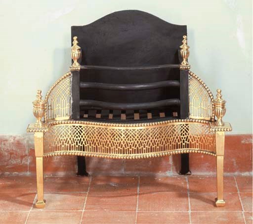 AN ENGLISH CAST IRON AND BRASS FIREGRATE