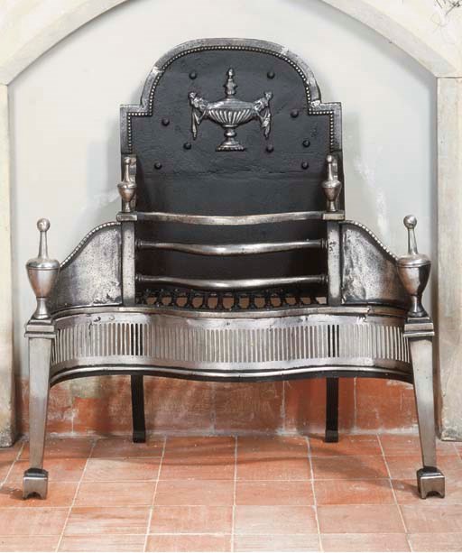 AN ENGLISH CAST IRON FIREGRATE