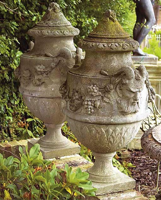 A PAIR OF COMPOSITION STONE URN FINIALS