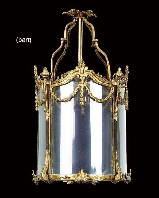 A gilt metal and glazed cylindrical hall lantern