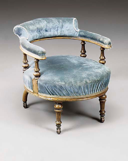 A LATE VICTORIAN WALNUT EASY ARMCHAIR