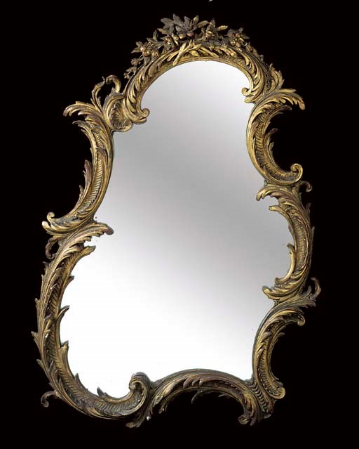 A VICTORIAN GILTWOOD AND COMPOSITION MIRROR